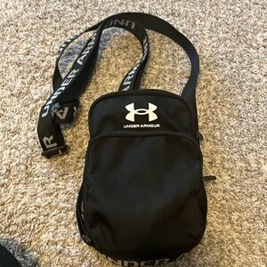 Under Armour black sling adjustable bag with pockets zippers purse crossbody